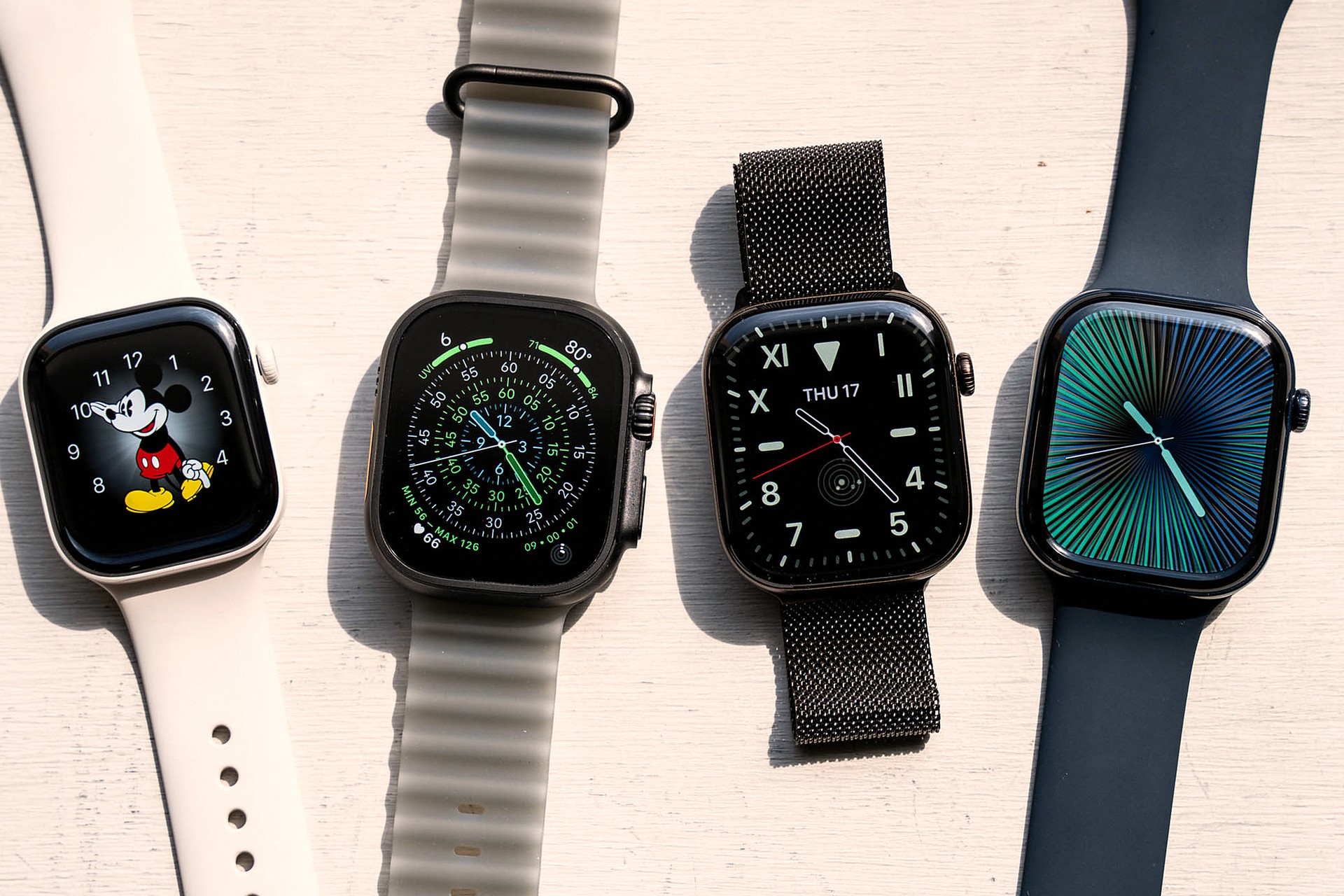 4 Apple Watches next to each other.